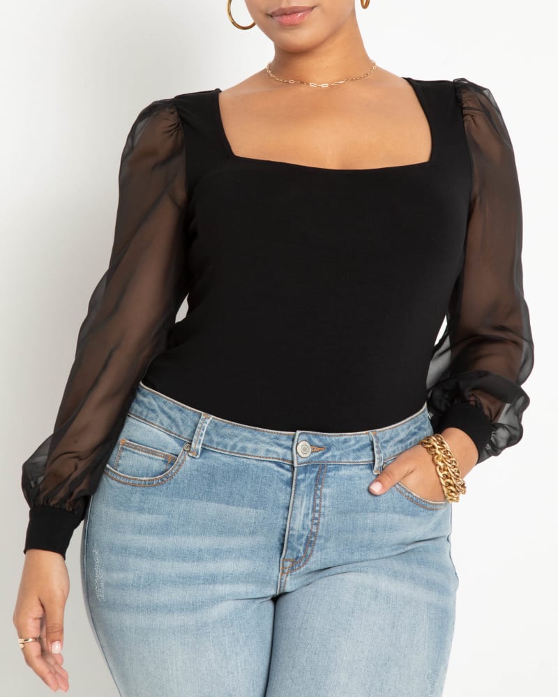 Front of a model wearing a size 14|16 Evelyn Square Neck Top in Totally Black by ELOQUII. | dia_product_style_image_id:216982